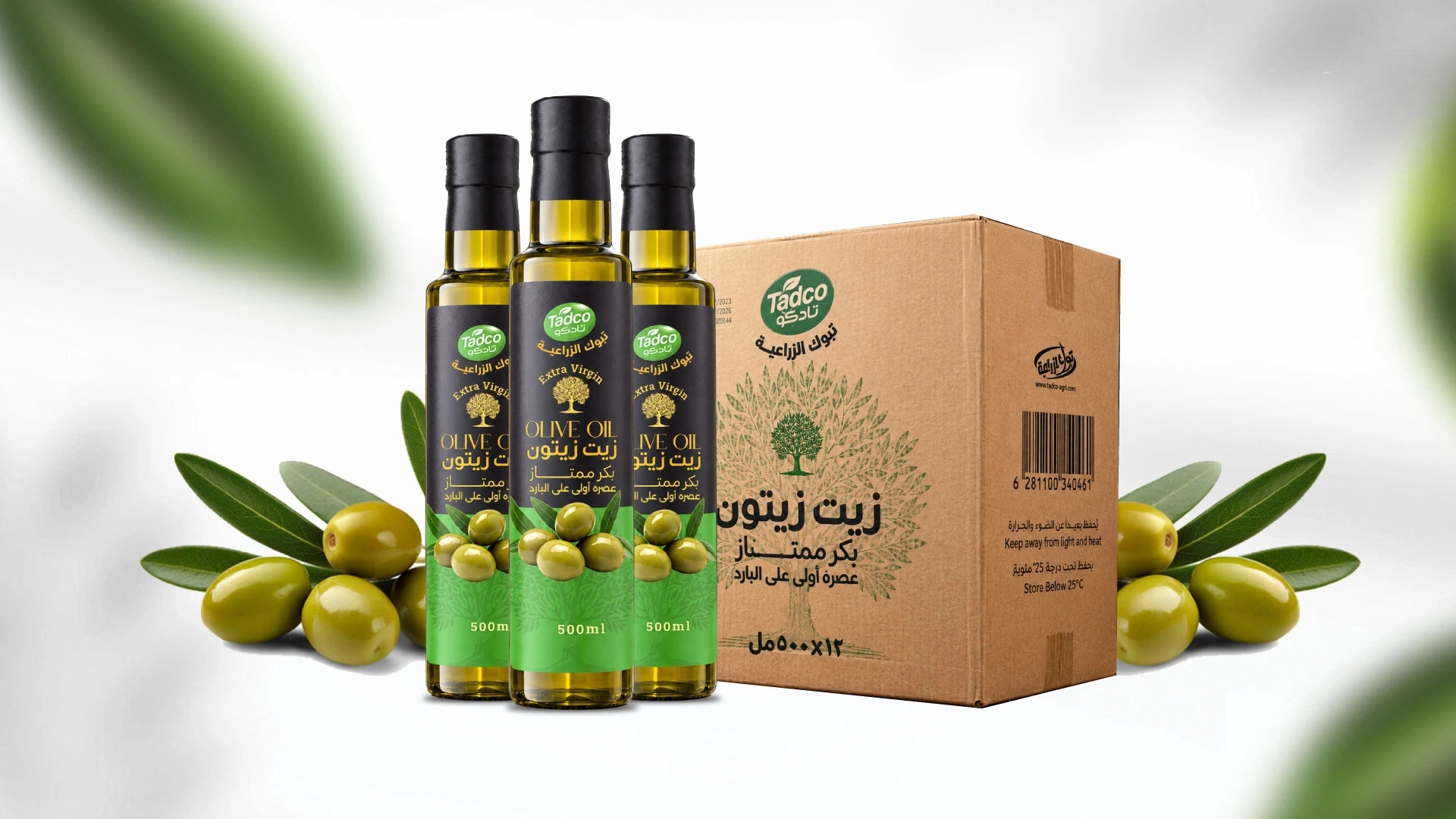 ثلاث عبوات من زيت زيتون تادكو مع صندوق المنتج وثمار الزيتون